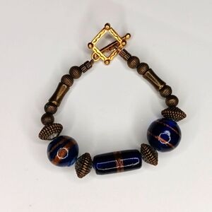 Unique blue and bronze beaded bracelet with copper tone beads with square toggle